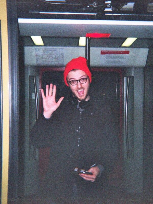 Charles Burdett waving from a Berlin U-Bahn, 2015